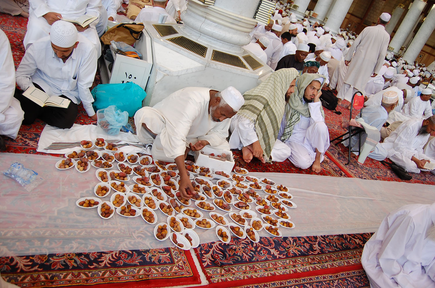 A feast of dates is laid out inside the mosque.